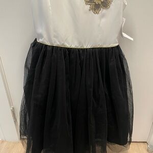 Girls dress. Black and white w gold detail. Knee length